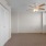 a room with a window and ceiling fan